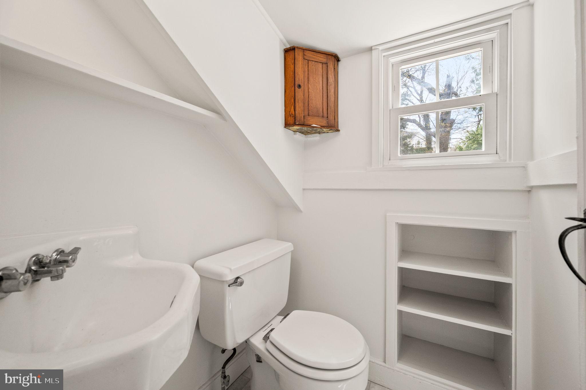 73 West Rose Valley Road Rose Valley, PA 19086 - Photo 24 of 38 a white toilet sitting next to a bathroom sink