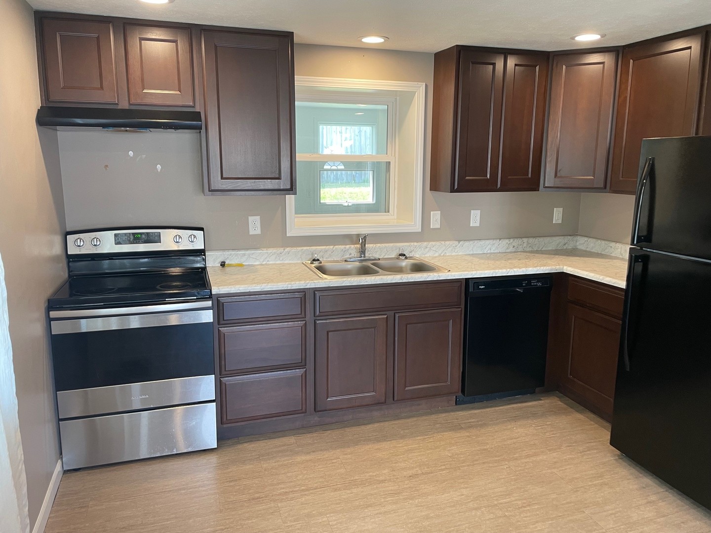 304 South Webster Street Mackinaw, IL 61755 - Photo 13 of 25 a kitchen with stainless steel appliances granite countertop a sink stove and refrigerator