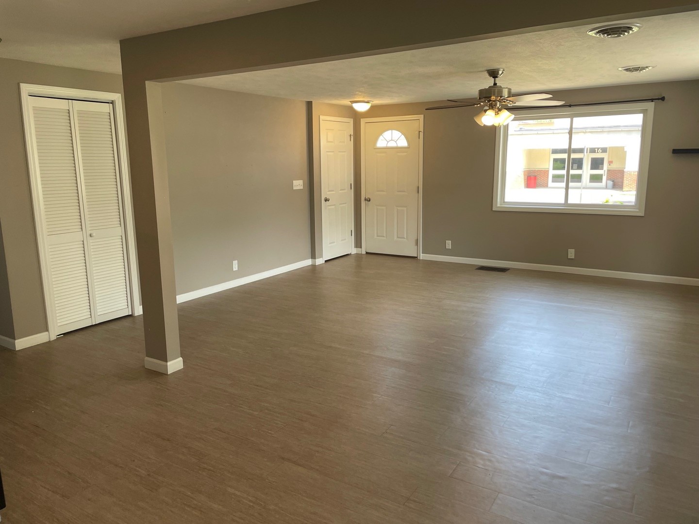 304 South Webster Street Mackinaw, IL 61755 - Photo 18 of 25 an empty room with wooden floor and windows