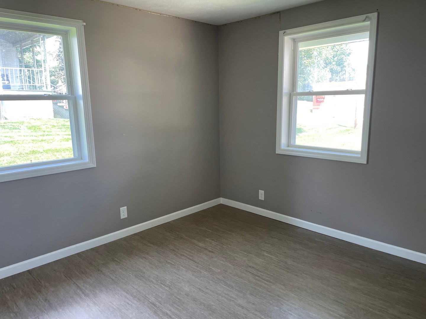 304 South Webster Street Mackinaw, IL 61755 - Photo 21 of 25 an empty room with wooden floor and windows