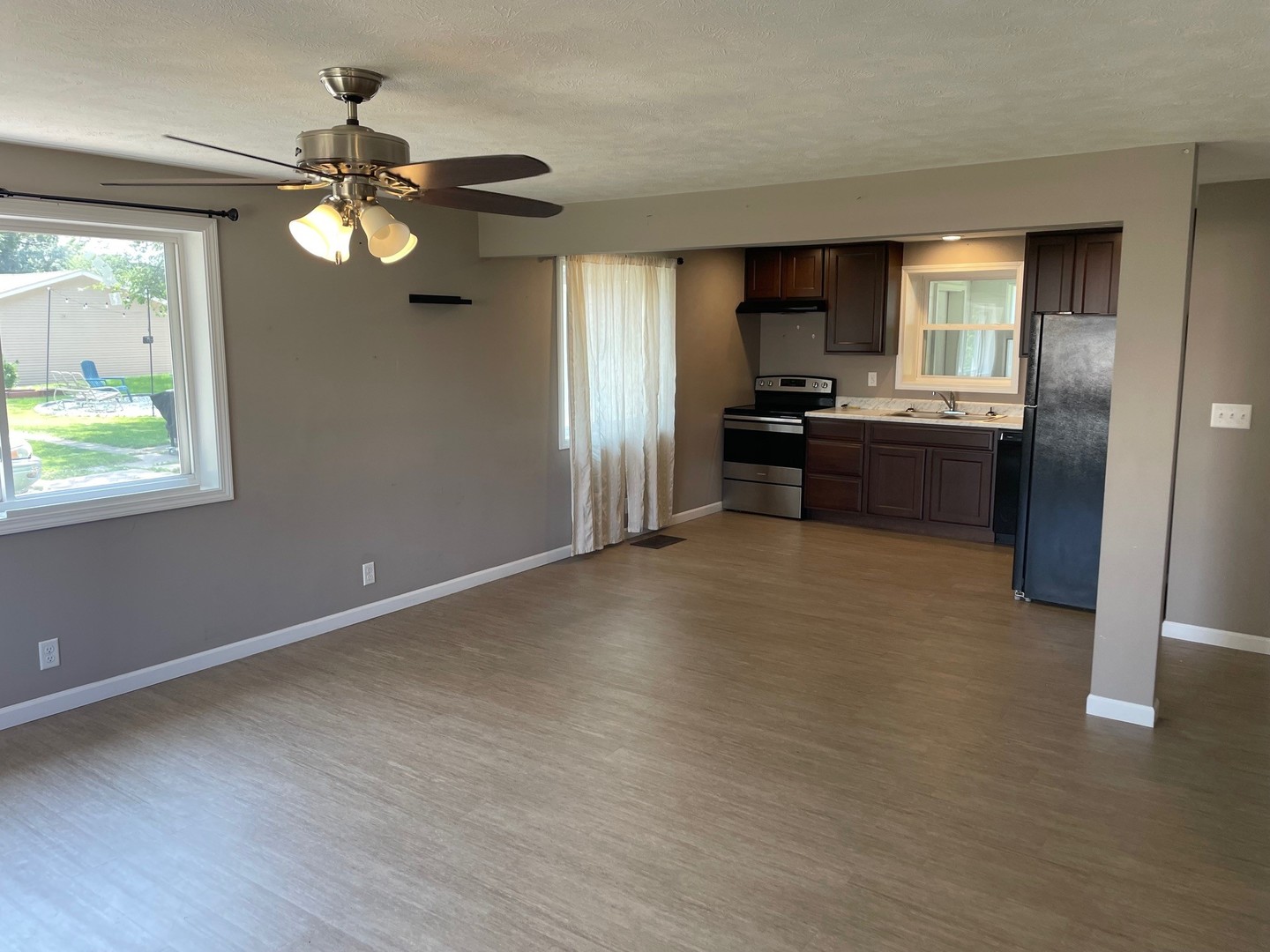304 South Webster Street Mackinaw, IL 61755 - Photo 9 of 25 a kitchen with a refrigerator and a sink