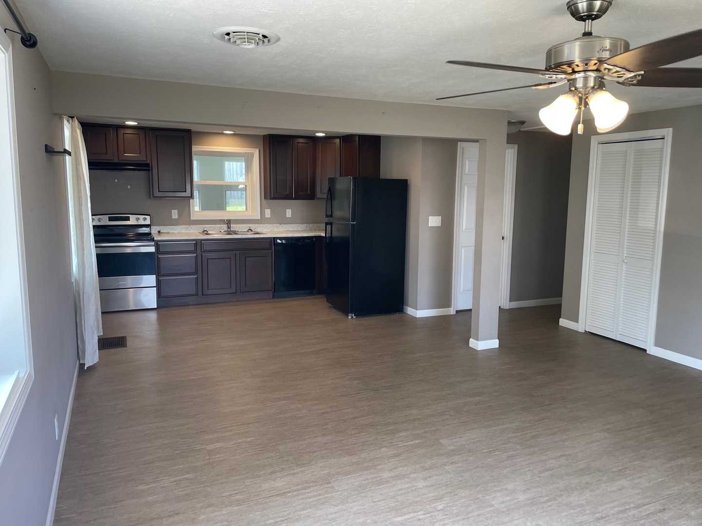 304 South Webster Street Mackinaw, IL 61755 - Photo 10 of 25 a kitchen with stainless steel appliances kitchen island granite countertop a refrigerator and a stove top oven