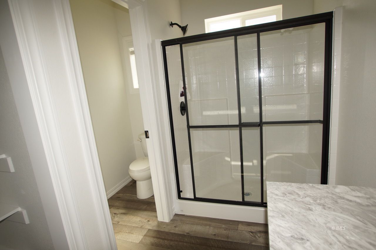 196 Tuolumne Road Bishop, CA 93514 - Photo 20 of 28 a bathroom with a glass door shower