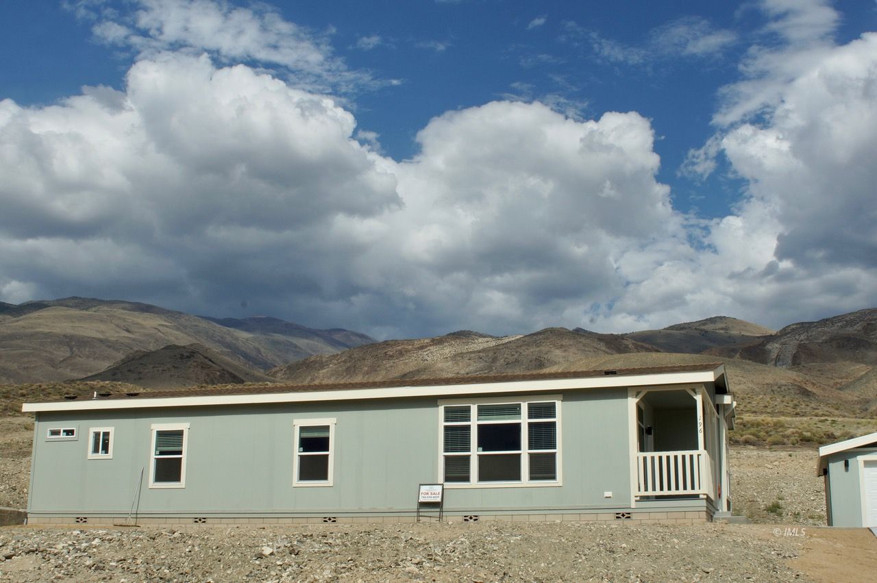 196 Tuolumne Road Bishop, CA 93514 - Photo 4 of 28 a front view of a house with a yard