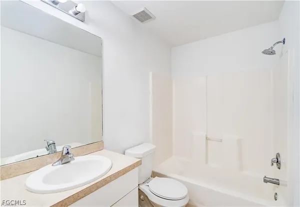a bathroom with a sink toilet and a bathtub