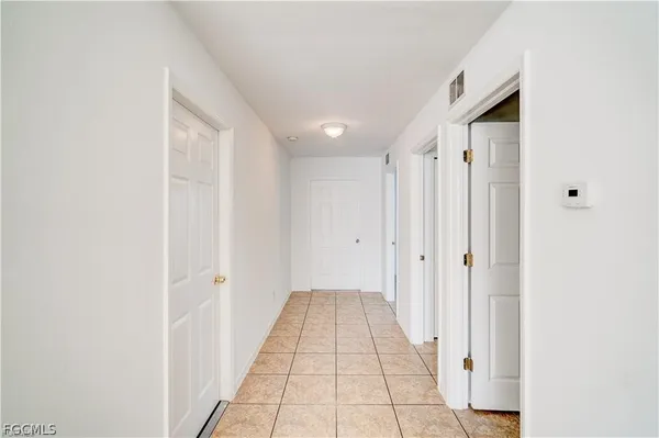 a view of a hallway with a white walls