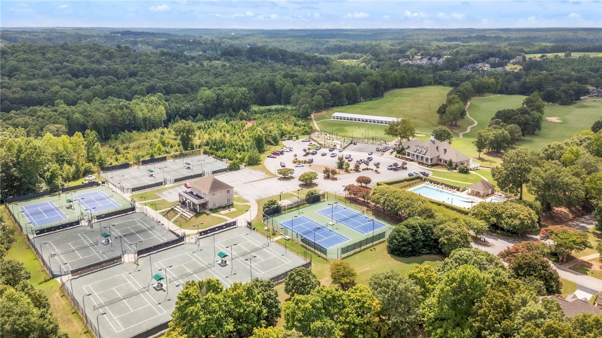 1015 Winmar Drive Anderson, SC 29621 - Photo 46 of 49 This aerial view showcases a vibrant community with tennis courts, a clubhouse, and a sparkling pool.