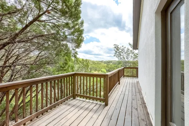 a view of balcony with wooden floor