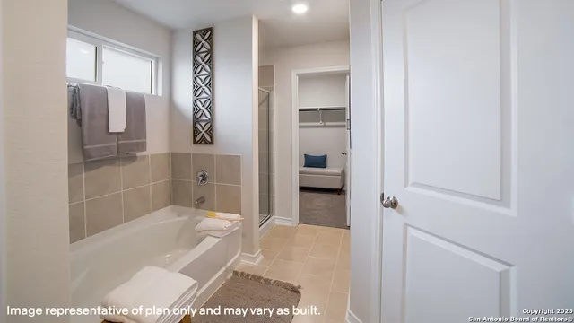 a bathroom with a tub and shower