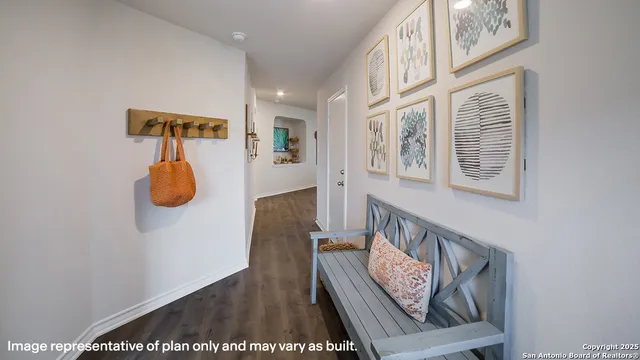 a view of an entryway with wooden floor