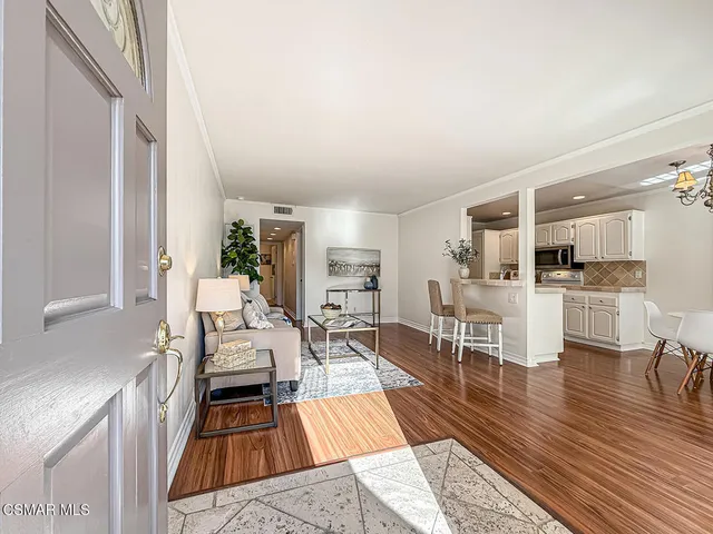 a living room with furniture and a table