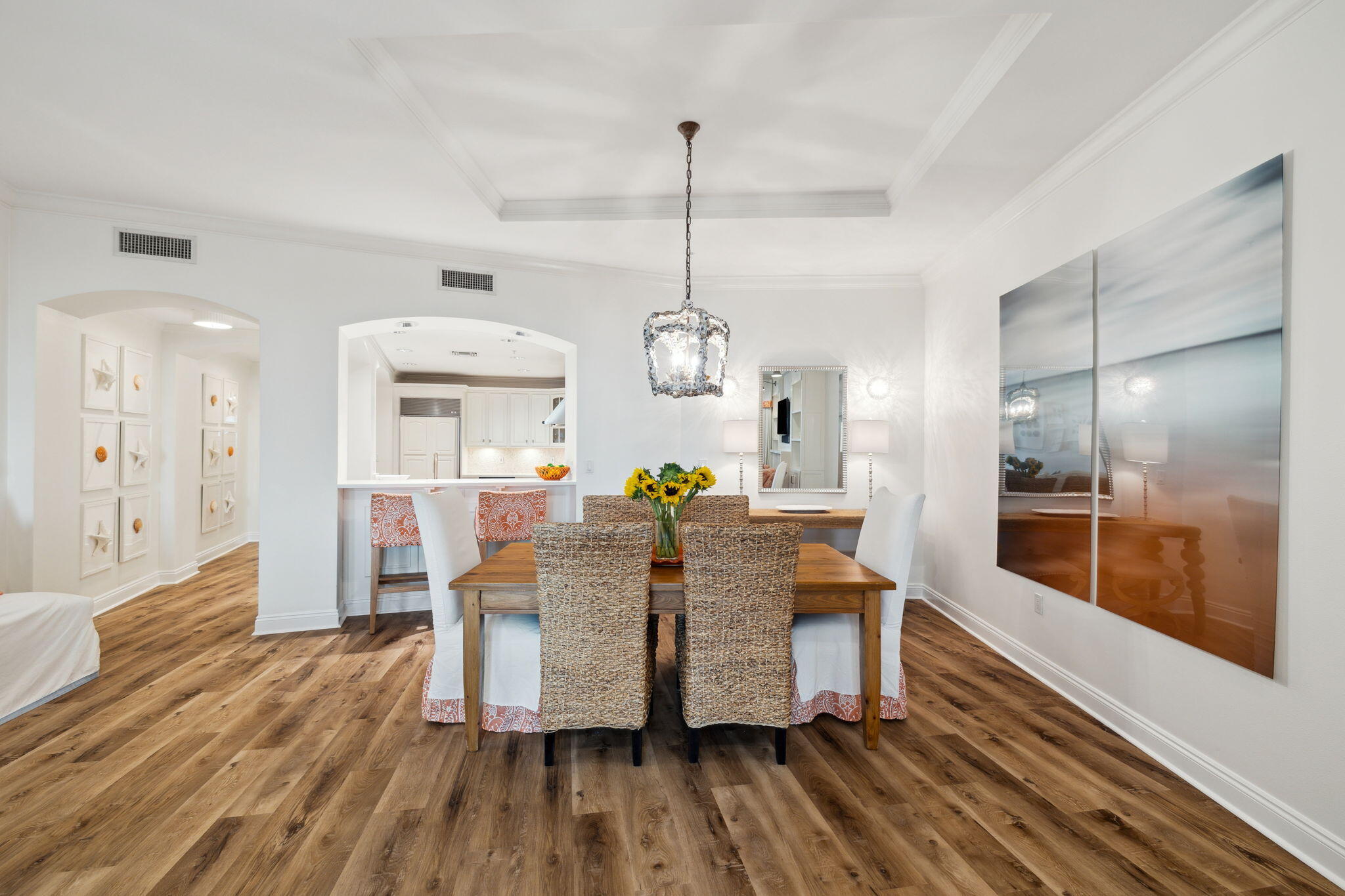 56 Blue Mountain Road, Unit B105 Santa Rosa Beach, FL 32459 - Photo 28 of 98 a view of a dining room and livingroom with furniture wooden floor a chandelier