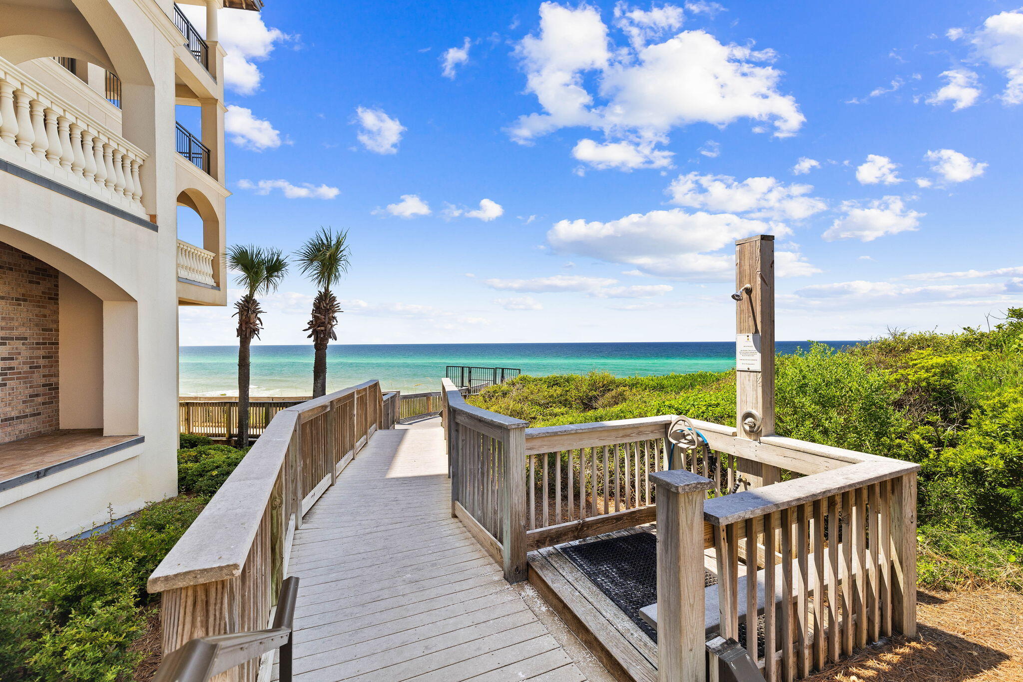 56 Blue Mountain Road, Unit B105 Santa Rosa Beach, FL 32459 - Photo 62 of 98 a view of a roof deck with wooden floor and fence