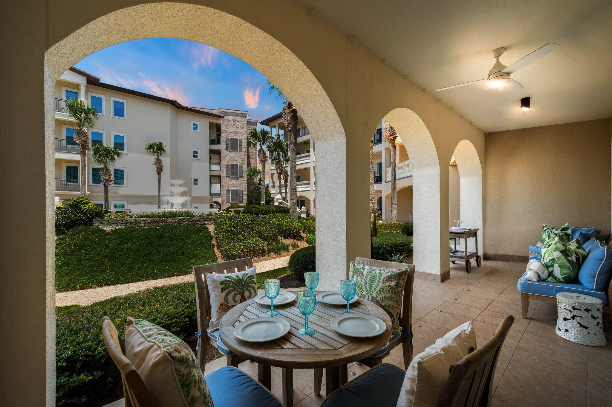 56 Blue Mountain Road, Unit B105 Santa Rosa Beach, FL 32459 - Photo 74 of 98 a view of a patio with couches table and chairs and potted plants