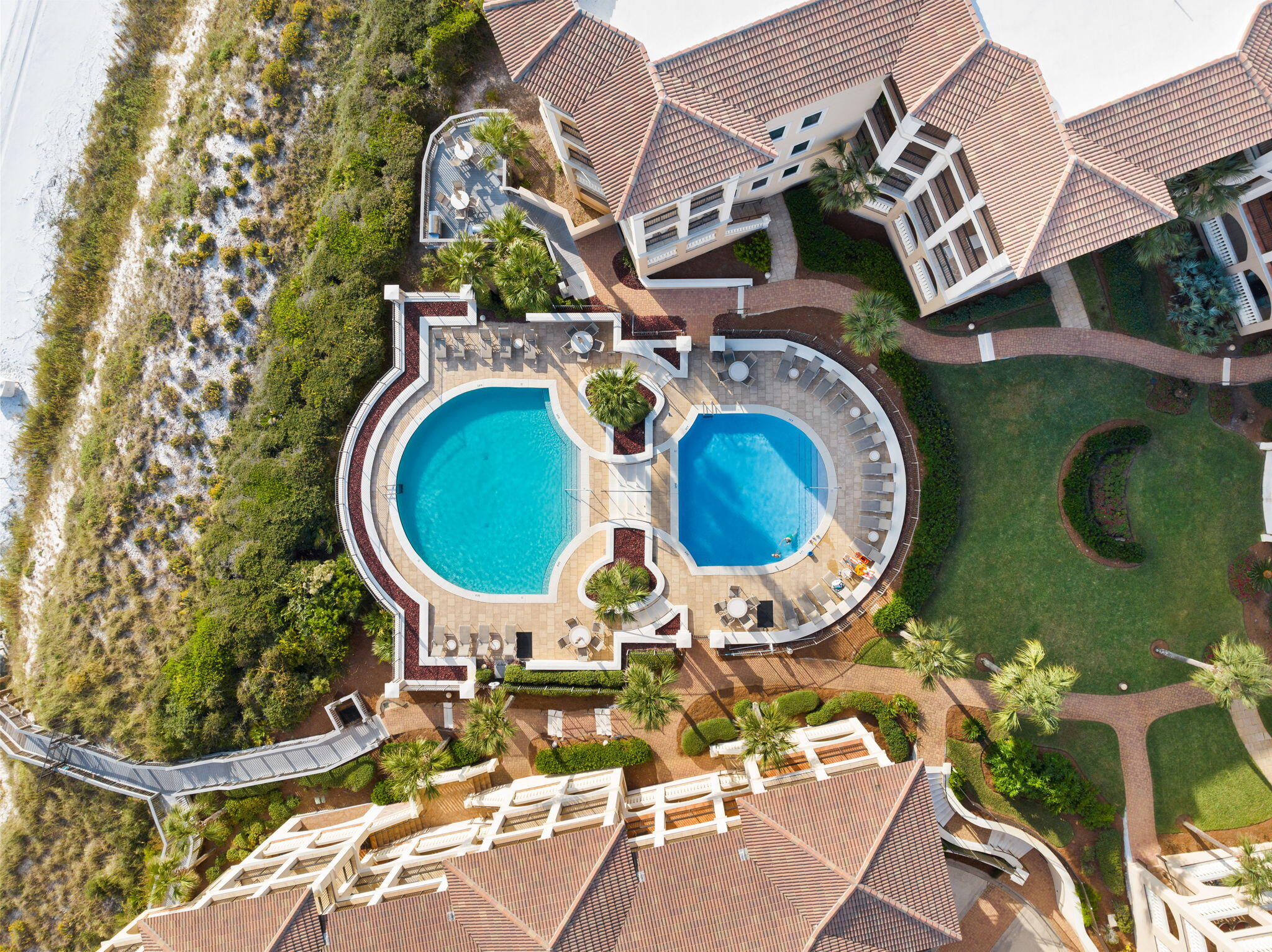 56 Blue Mountain Road, Unit B105 Santa Rosa Beach, FL 32459 - Photo 83 of 98 an aerial view of a swimming pool with outdoor seating and barbeque oven