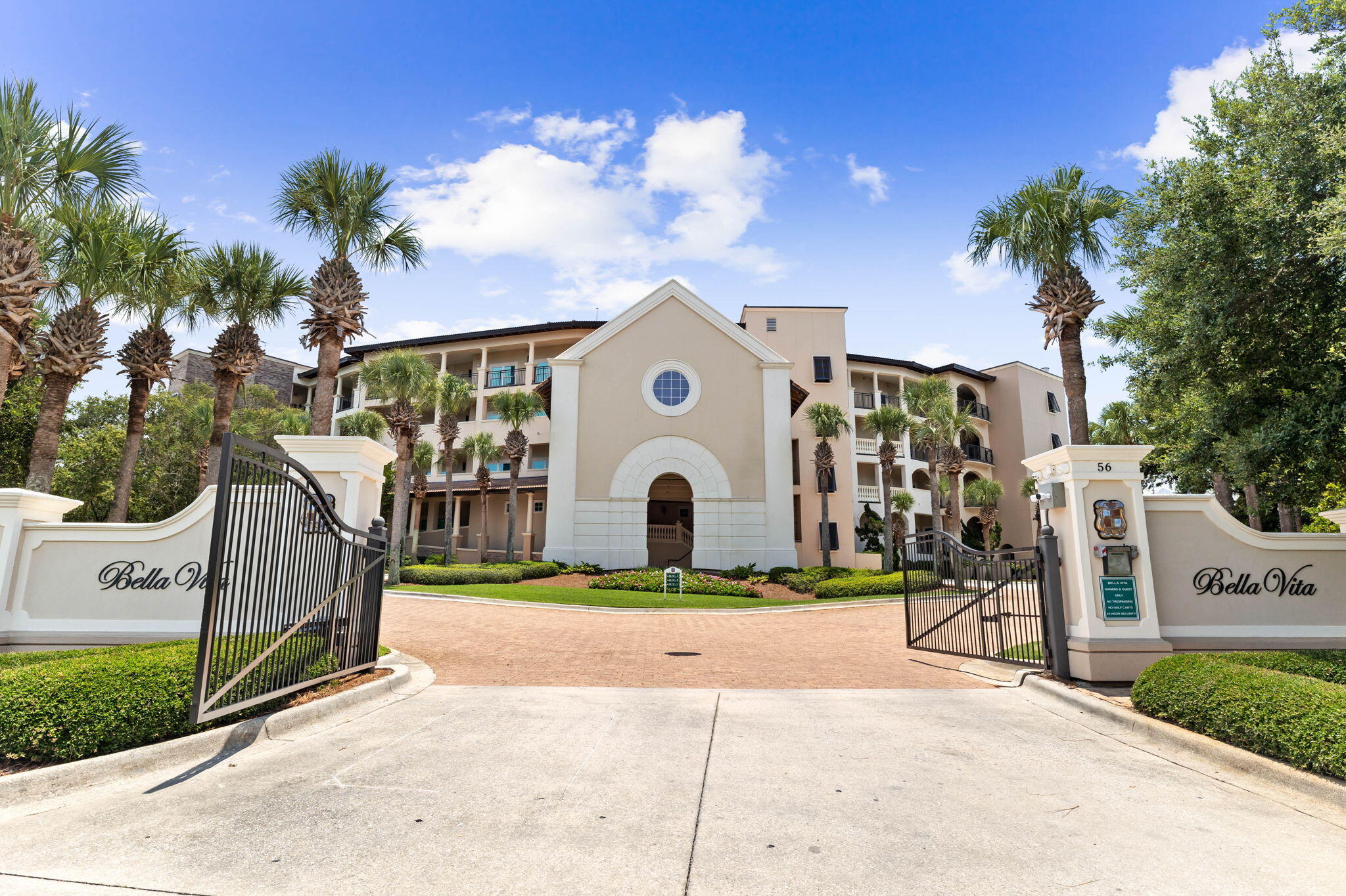 56 Blue Mountain Road, Unit B105 Santa Rosa Beach, FL 32459 - Photo 89 of 98 a front view of a house with a yard and potted plants