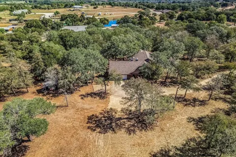 a view of a yard with trees