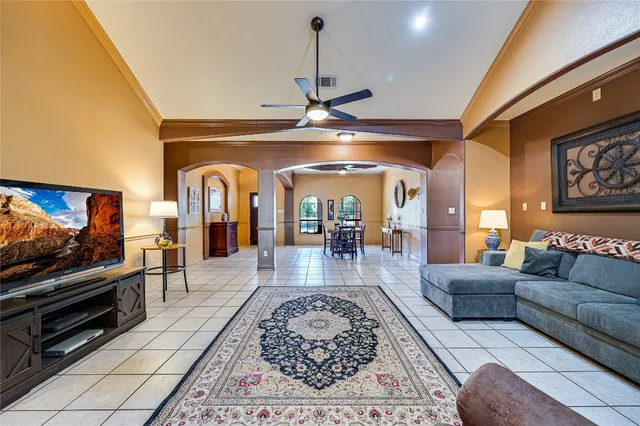 a living room with furniture and a flat screen tv