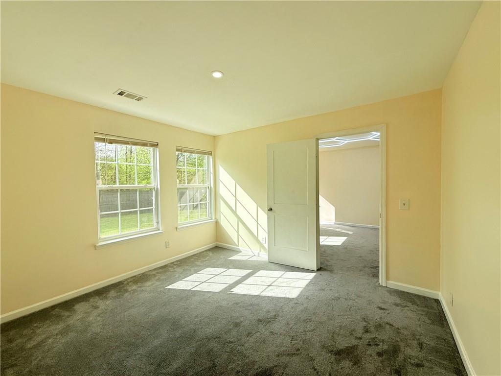 893 Hawthorn Lane Grayson, GA 30017 - Photo 11 of 11 a view of an empty room with a window