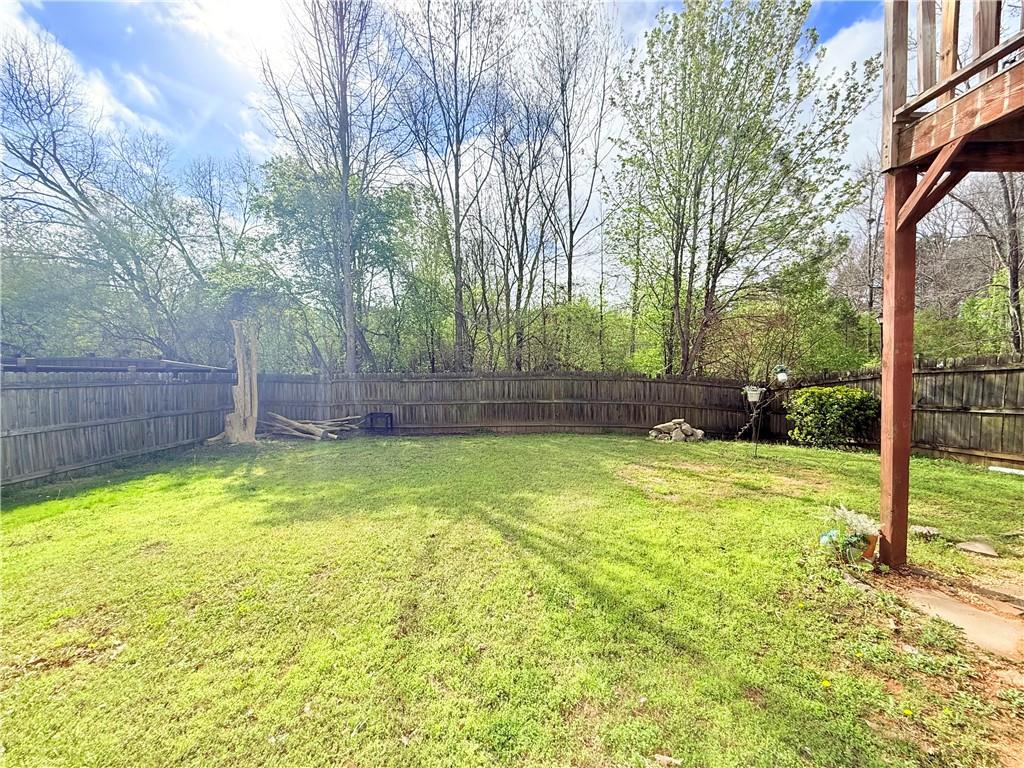 893 Hawthorn Lane Grayson, GA 30017 - Photo 2 of 11 a view of swimming pool with backyard and trees