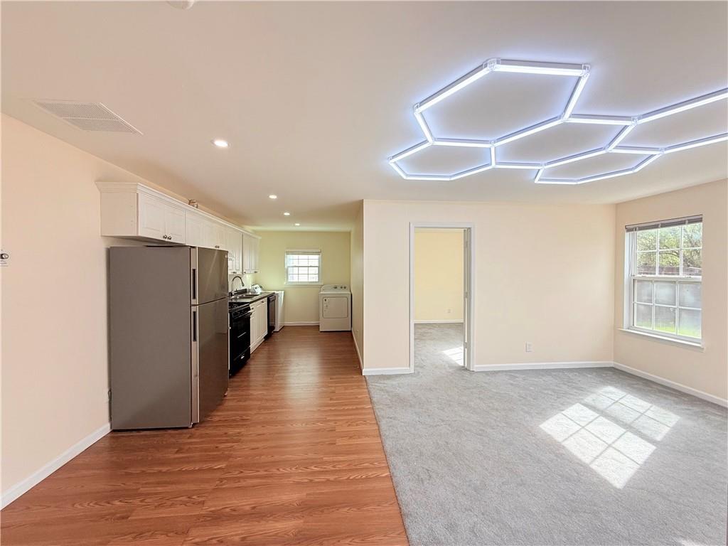 893 Hawthorn Lane Grayson, GA 30017 - Photo 5 of 11 a view of a livingroom with wooden floor