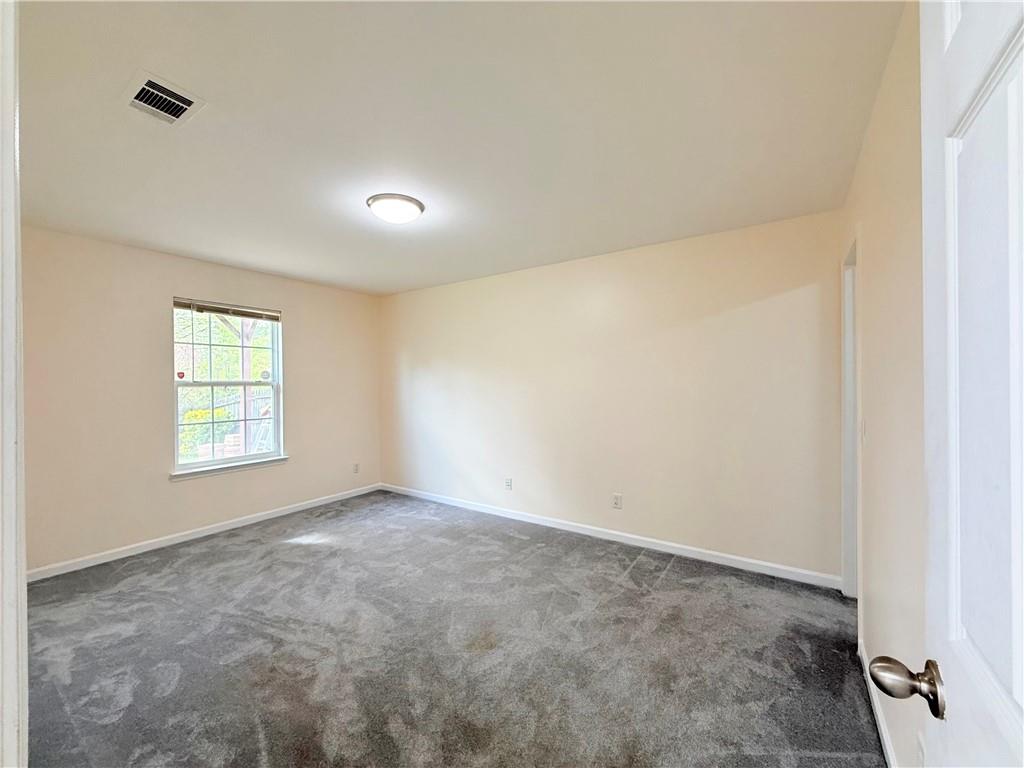893 Hawthorn Lane Grayson, GA 30017 - Photo 8 of 11 an empty room with windows