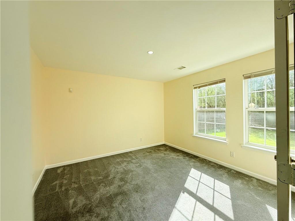 893 Hawthorn Lane Grayson, GA 30017 - Photo 10 of 11 a view of an empty room with a window