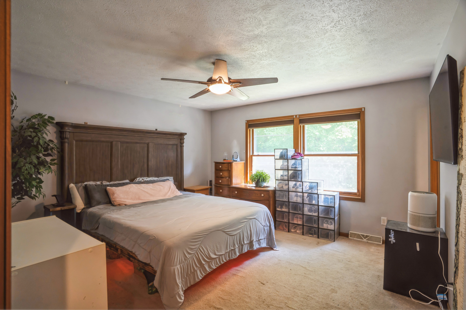 5444 10th Avenue Moline, IL 61265 - Photo 13 of 20 a bedroom with a bed and a chandelier