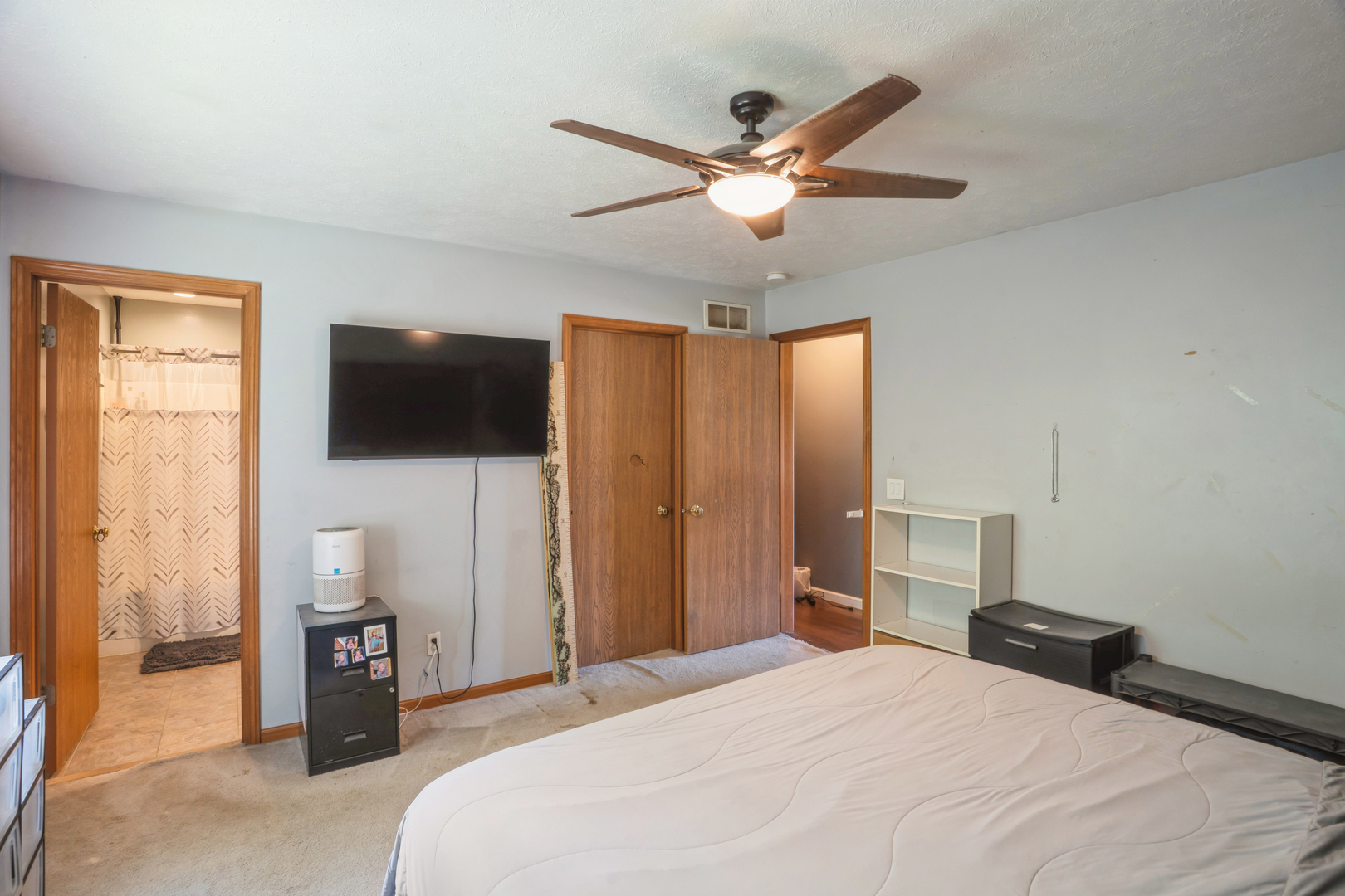 5444 10th Avenue Moline, IL 61265 - Photo 14 of 20 a bedroom with a bed and a flat tv screen on dresser