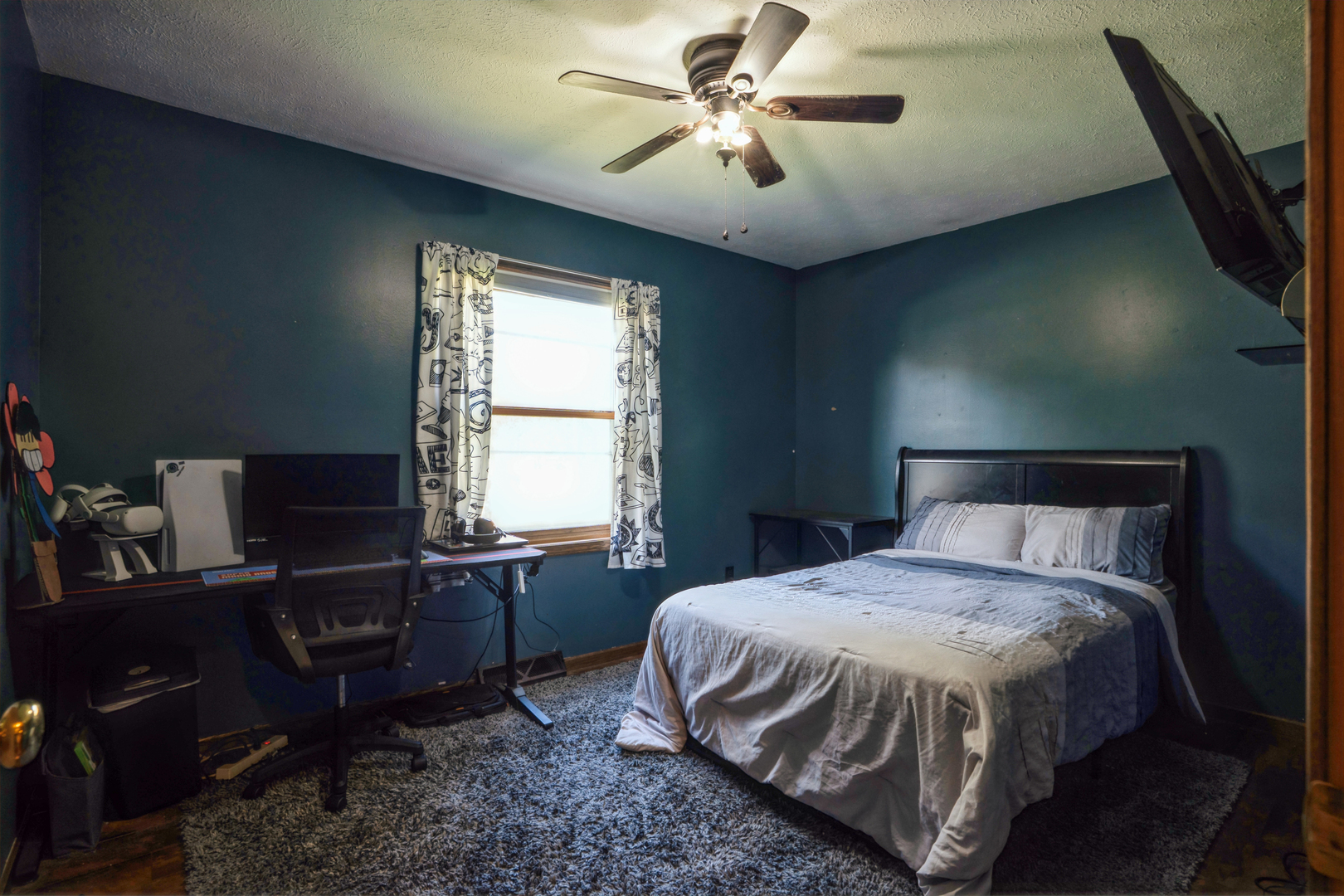 5444 10th Avenue Moline, IL 61265 - Photo 9 of 20 a bedroom with a bed and a chandelier