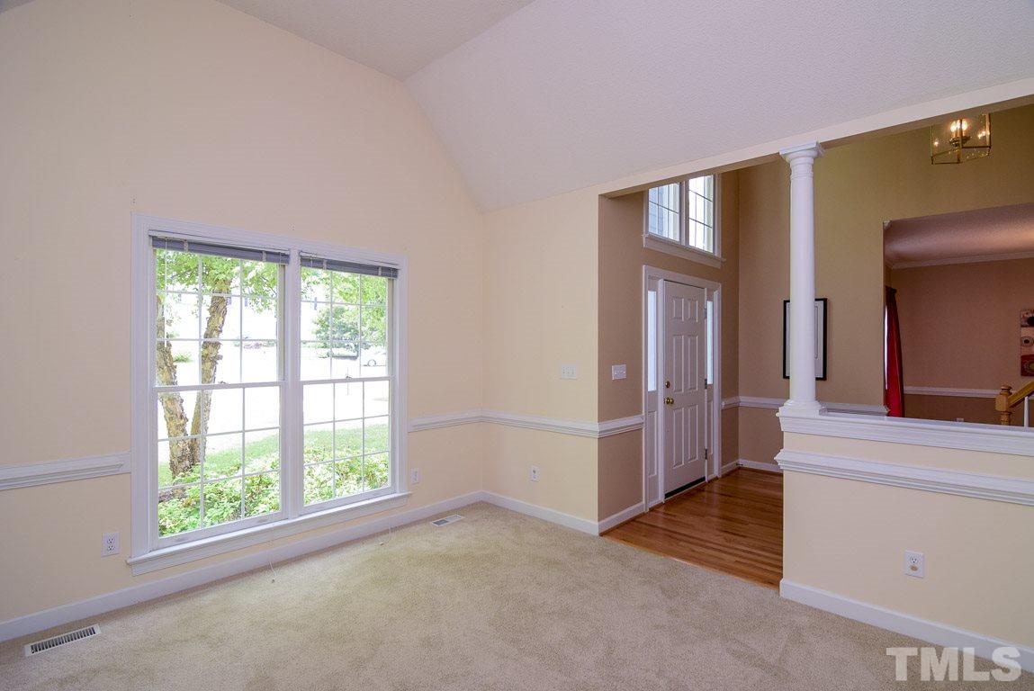 8808 Salute Street Raleigh, NC 27615 - Photo 10 of 25 Formal living room would be great for a book club, Grand Piano, or you could use it as an office.