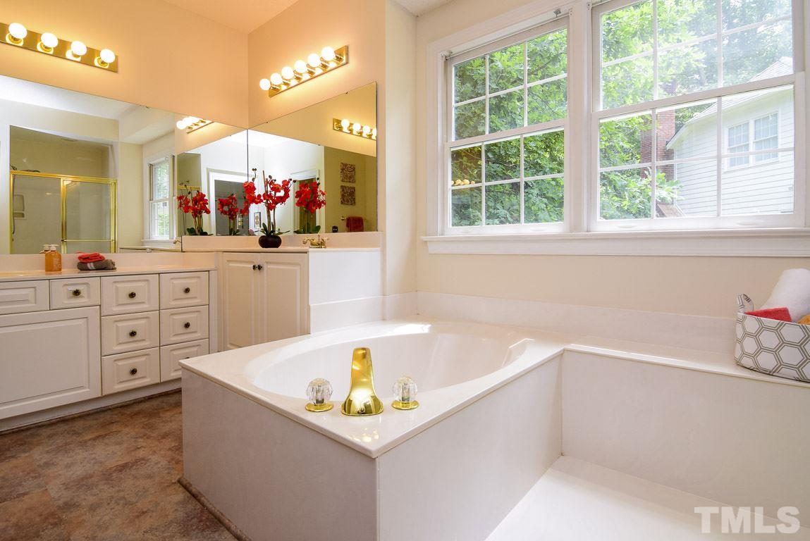 8808 Salute Street Raleigh, NC 27615 - Photo 12 of 25 Spa Bath with Double Vanities and Whirlpool tub and Separate Shower.