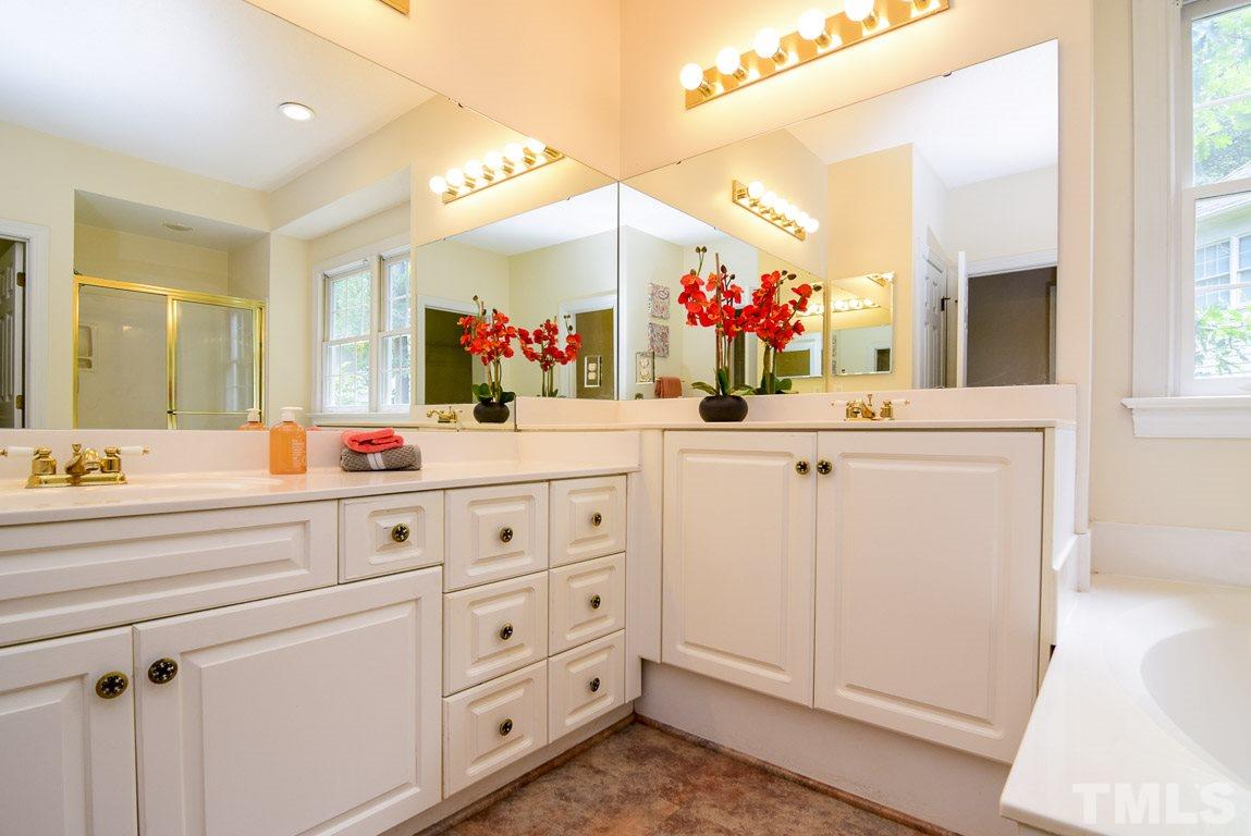 8808 Salute Street Raleigh, NC 27615 - Photo 13 of 25 2 vanities makes getting ready in the morning a breeze. One is a little taller for him!