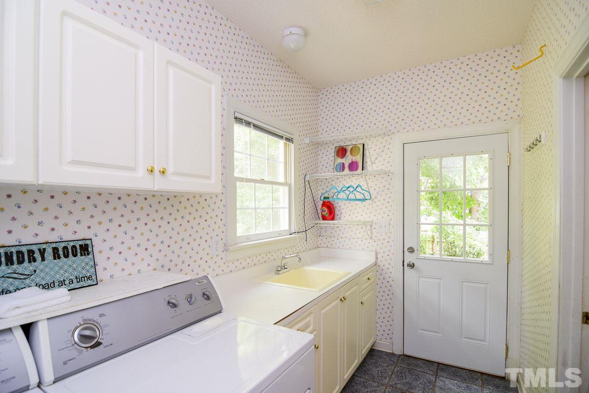 8808 Salute Street Raleigh, NC 27615 - Photo 20 of 25 Laundry Room/Mudroom with extensive storage and a laundry sink.