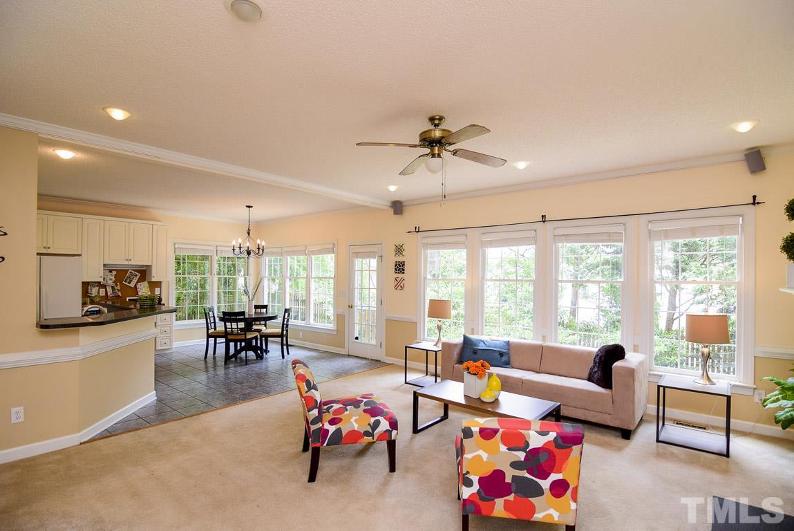 When you walk into the family room you are greeted by a bank of bright  windows that stretch across the rear wall.