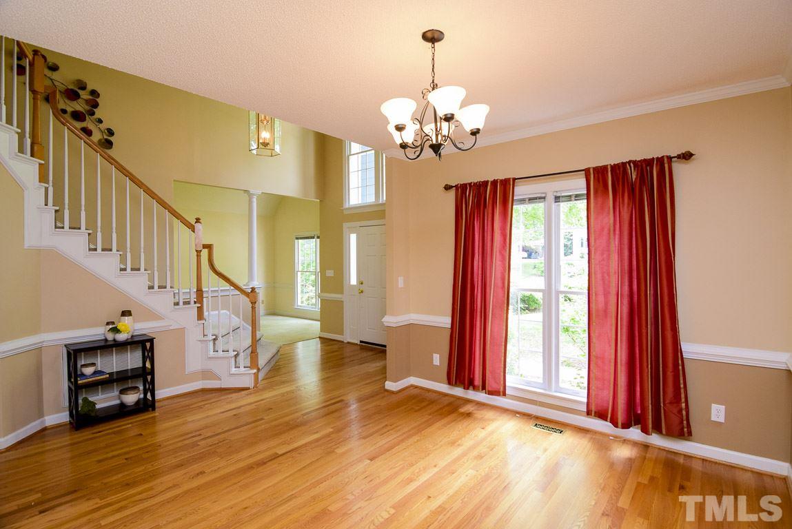 8808 Salute Street Raleigh, NC 27615 - Photo 9 of 25 Dining room is much larger than your typical North Raleigh home and perfect for all the important holidays. It opens to a 2 story foyer so plenty of room to set up an extra folding table for extra guests. You can finally use all the leaves in your table!