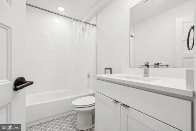 a bathroom with a sink a toilet and a bathtub