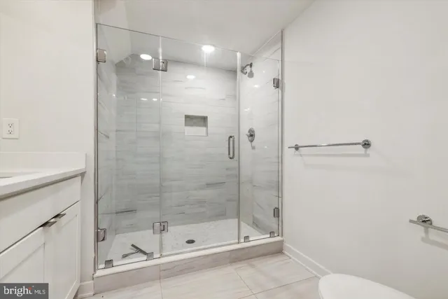 a bathroom with a shower and toilet