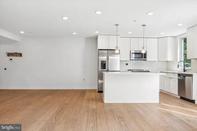 a view of kitchen with wooden floor