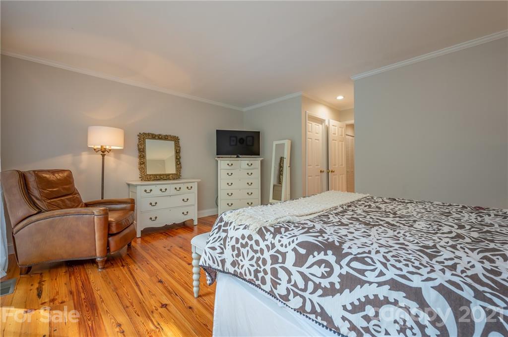 33 Hunting Country Trail Tryon, NC 28782 - Photo 12 of 34 a bed room with a bed and a television