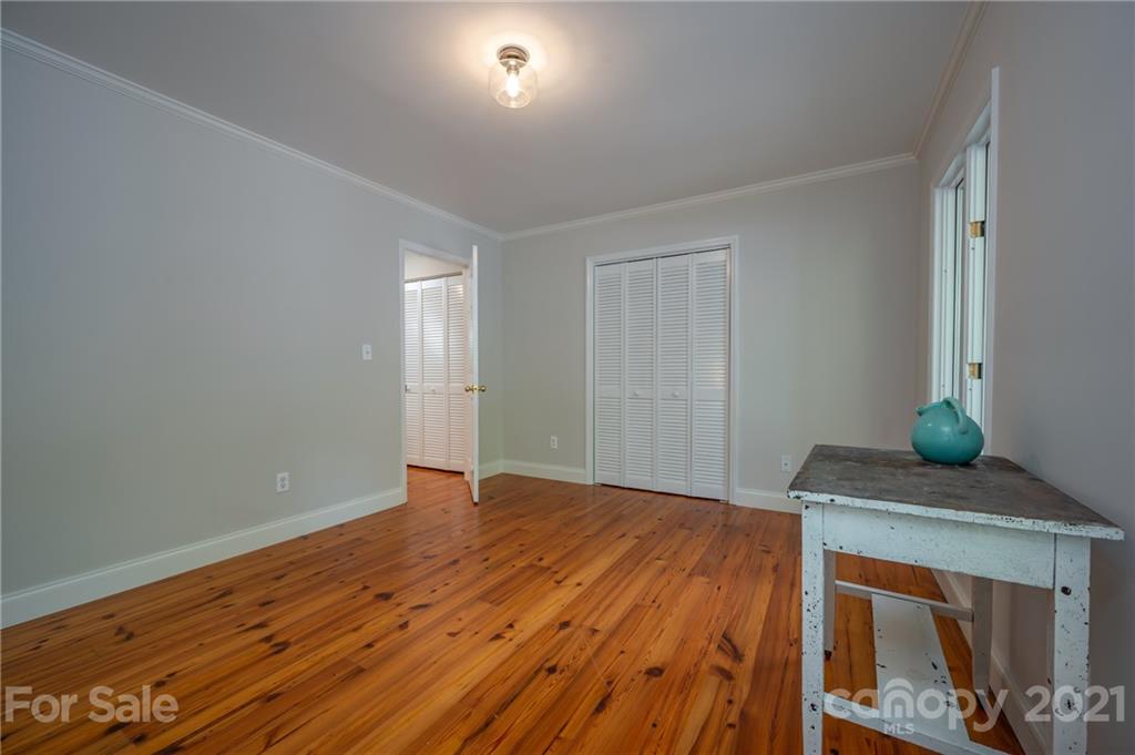 33 Hunting Country Trail Tryon, NC 28782 - Photo 17 of 34 a view of empty room with wooden floor