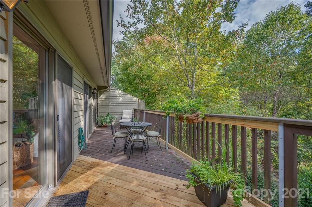 33 Hunting Country Trail Tryon, NC 28782 - Photo 20 of 34 a view of balcony with furniture and garden