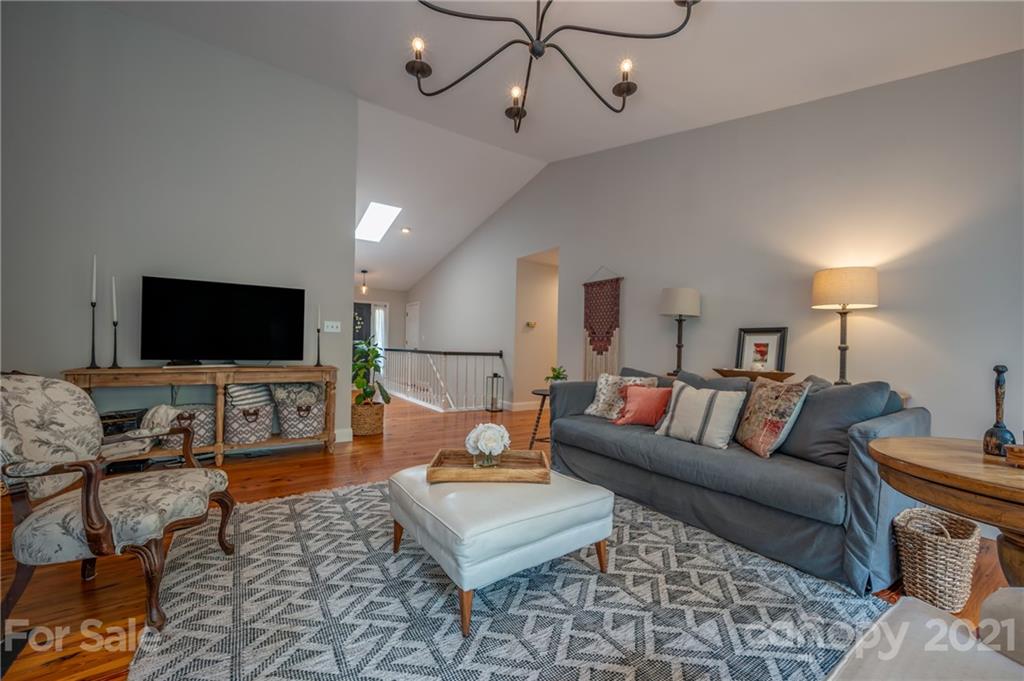 33 Hunting Country Trail Tryon, NC 28782 - Photo 5 of 34 a living room with furniture and a flat screen tv