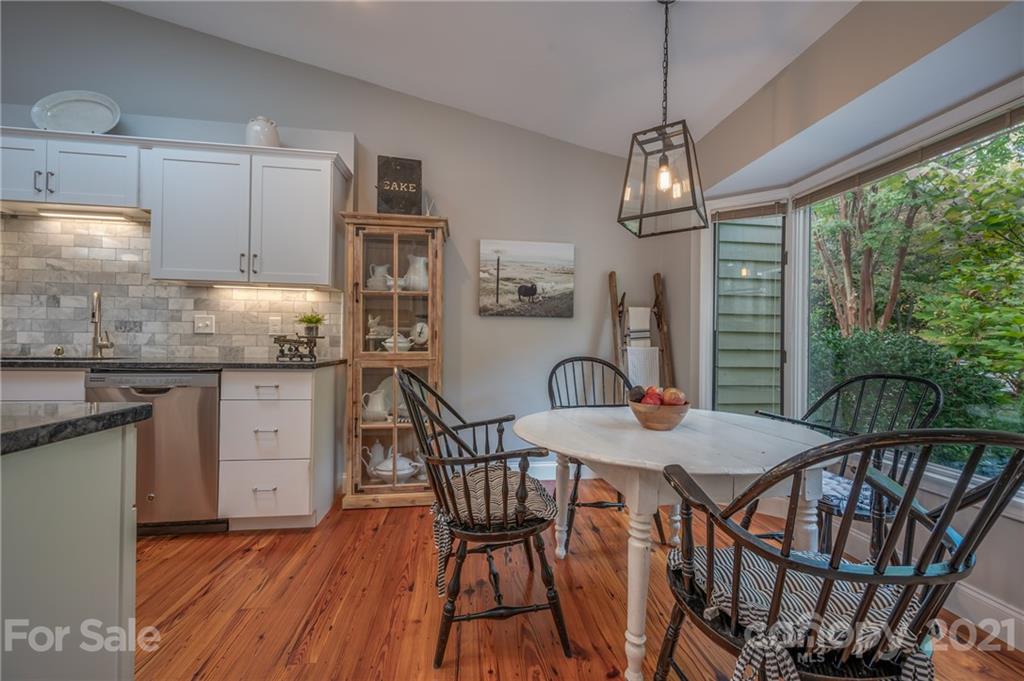 33 Hunting Country Trail Tryon, NC 28782 - Photo 8 of 34 a view of a dining room with furniture window and wooden floor