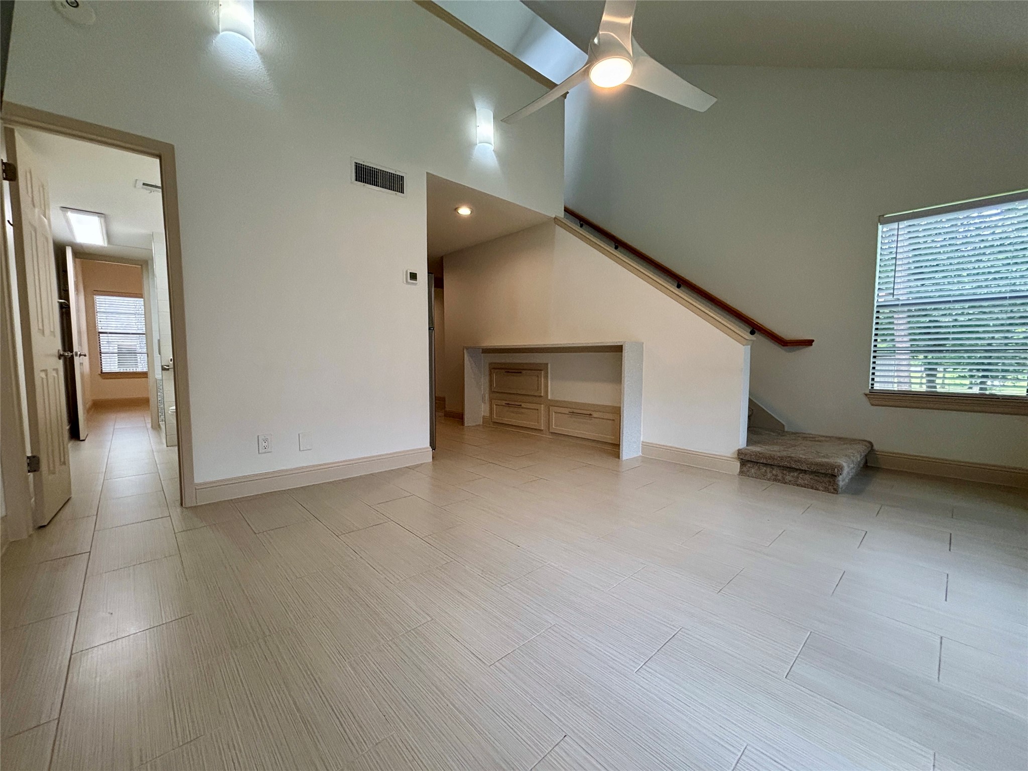 12900 Walden Road, Unit 508E Montgomery, TX 77356 - Photo 9 of 25 an empty room with windows and pillars in it