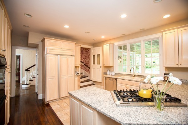 5 Hewins Farm Road Wellesley, MA 02481 - Photo 14 of 18 a view of a kitchen with dining table and windows