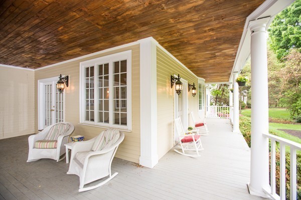 5 Hewins Farm Road Wellesley, MA 02481 - Photo 3 of 18 a balcony with wooden floor and furniture
