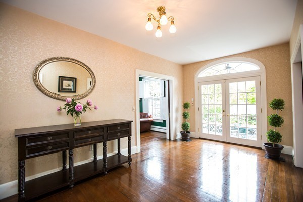 5 Hewins Farm Road Wellesley, MA 02481 - Photo 4 of 18 a view of a livingroom with furniture hardwood floor and a large window