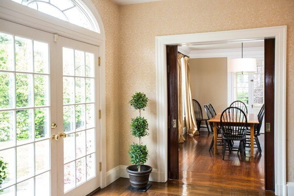 5 Hewins Farm Road Wellesley, MA 02481 - Photo 10 of 18 a dining room with furniture potted plants and wooden floor