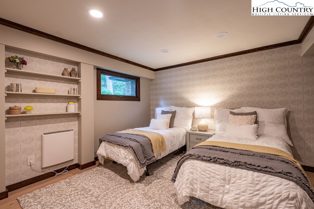 102 Ridge Drive Linville, NC 28646 - Photo 44 of 48 a bedroom with two beds and painting on the wall